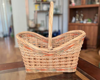 Lot 34: Oval handwoven wicker basket with handle and small wicker basket
