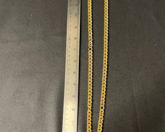 Lot 135: One gold-tone curb-link chain necklace with loose link