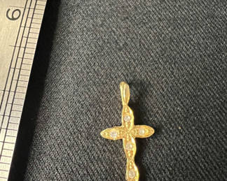 Lot 124: Vintage gold-tone cross pendant, filigree flower brooch, and rosebud pin