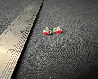 Lot 119: Three pairs of earrings: red enamel studs, color‑enamel hoops, and gold-tone pearl studs