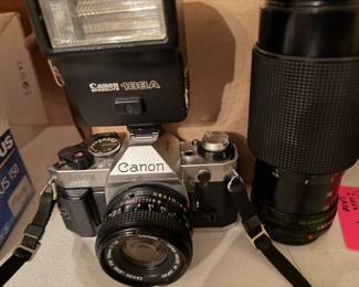 Canon AE-1 with two lens, flash, and bag