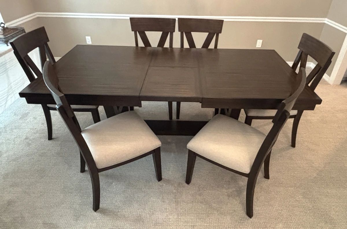 BUY IT NOW! $750.00. Dining table w/six upholstered chairs. 42" W x 68" L x 30" H. (86" L with leaf). Call Jan at 314 960-5700
