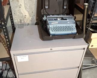 Electric typewriter, two drawer file cabinet.