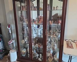 large three-door cherry or mahogany wood curio cabinet
