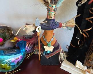 This is a spirit doll or warrior figure commonly handcrafted from dried gourds