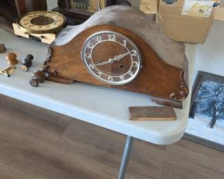 American tambour mantel clock (often called a "humpback" clock), manufactured around the 1920s to 1930s.
