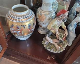 Left: Egyptian-Revival King Tutankhamun Porcelain Vase Right Foreground: Capodimonte "Old Fisherman Cleaning Fish" Porcelain Figurine