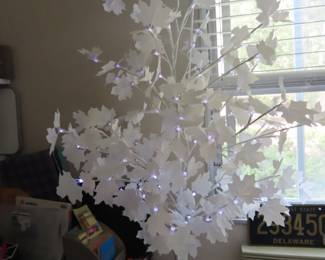 Prelit white maple leaf with LED lights.