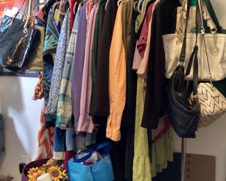 Several racks of clothes! Sizes 12 - 22w.