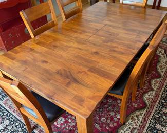 ectangular dining table in plank-top solid mango wood with a warm honey finish. Seats six comfortably. Comes w/ 6 matching ladder-back chairs upholstered in dark brown leather seats. $1200 set.
