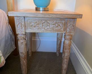 Whitewashed floral Mexican carved wood bedside tables, $100 each.