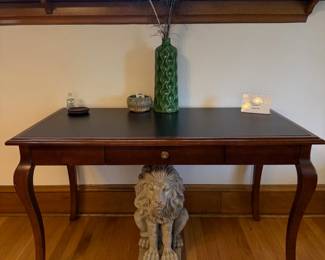 Cherry-finished console with a shaped top, single drawer, and graceful cabriole legs. $100