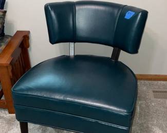Mid-century modern teal vinyl barrel-back accent chair