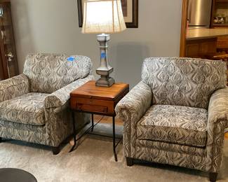 Pair of matching upholstered armchairs with decorative nailhead trim