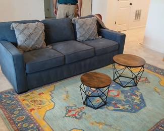 contemporary blue suede style 3 seat sofa, Kilim style 8 x10 rug, walnut top wire frame octohedron tables