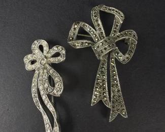 017 pairofsterlingsilverbowbrooches