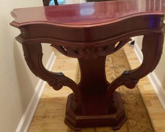 Behind the couch table very nicepiece, nice detailing handcrafted.