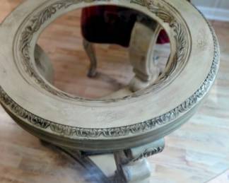A large glass top dining room table, we baveled glass. Edges and smo solid three legged base handcrafted very heavy piece