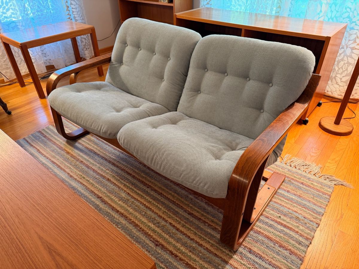Unique and rare Westnofa bent teak wood loveseat in excellent vintage condition. There are two of these and they will be sold separately