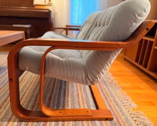 Unique and rare Westnofa bent teak wood loveseat in excellent vintage condition. There are two of these and they will be sold separately