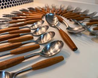 Incredible 50 piece set of vintage Dansk IHQ Fjord teak and stainless steel flatware set designed by Jens Quistgaard