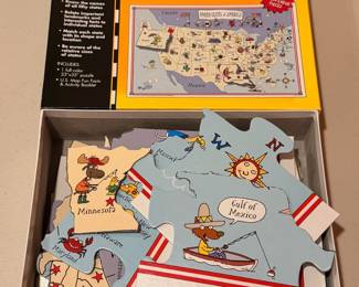 A sampling of the large selection of puzzles, including 3D puzzles and sets by Ravensburger and Springbok