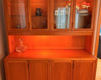 Ca. Late 60’s/early 70’s teak display cabinet by D-Scan. This two-piece cabinet is in excellent vintage condition and measures 61”W x 77”T x 20”D