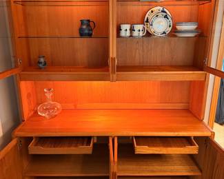 Ca. Late 60’s/early 70’s teak display cabinet by D-Scan. This two-piece cabinet is in excellent vintage condition and measures 61”W x 77”T x 20”D