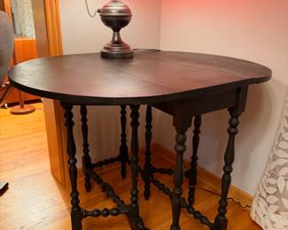 Antique spindle gate leg table in dark ebony finish