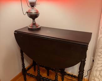 Antique spindle gate leg table in dark ebony finish