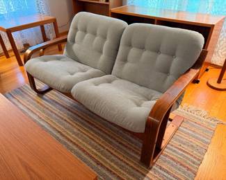 Unique and rare Westnofa bent teak wood loveseat in excellent vintage condition. There are two of these and they will be sold separately