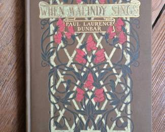 Rare book of Dunbar poetry with photos by Hampton Institute