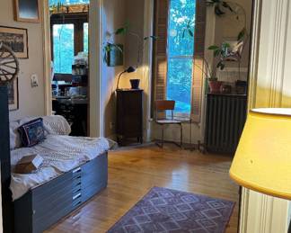Eclectic Artist Loft Interior with Industrial Furniture, Mid-Century Decor, Art & Lighting