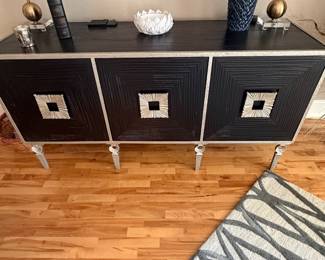 This piece is by Global Views of California. Extremely heavy wood and iron . So stunning