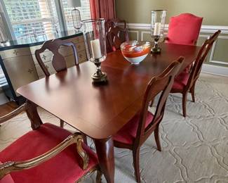 Thomasville dining table with 2 leaves and 6 chairs and matching china cabinet