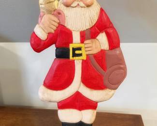 This is a vintage hand-painted folk art wooden Santa figurine featuring a classic flat-cut dimensional design mounted on a green rectangular base.