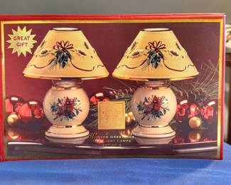 A set of two Lenox Winter Greetings Tea Light Lamps featuring a festive red cardinal and holly design.
