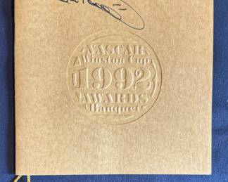 This is a rare 1992 NASCAR Winston Cup Awards Banquet program/menu, featuring an autograph on the cover.