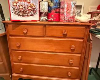 This is a vintage solid wood chest of drawers, likely crafted in the mid-20th century, featuring traditional round wooden pull knobs.
