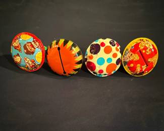 These are vintage tin litho clown-themed rattle and noise makers manufactured by the U.S. Metal Toy Mfg. Co. in the 1950s and 1960s.
