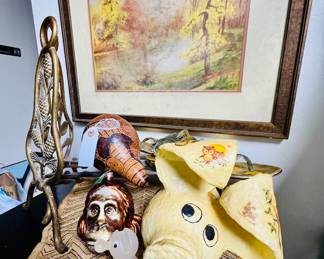 Acorn & pine brass andirons, paper mache piggy a duck a wood bird a Murano glass chickadee and a lot of African artifacts