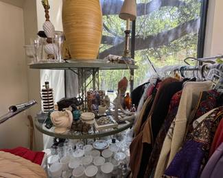 Multi tier layered antique or vintage rpund display rack would be great in shop or cool home planter shed