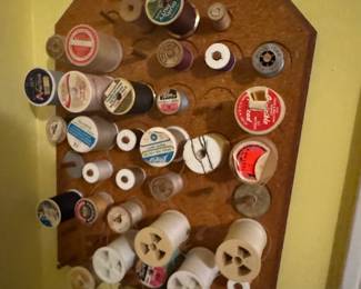 Vintage Wall-Mounted Wooden Thread Spool Rack with Assorted Thread