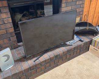 Modern Samsung Flat-Screen Smart TV with Stand