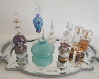Collection of Vintage Perfume Bottles on Mirrored Tray