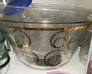 Mid-Century Modern Style Gold Circle Glass Bowl, Pyrex Bakeware and Assorted Bottles