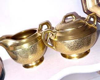 Gold, ceramic sugar, and creamer set