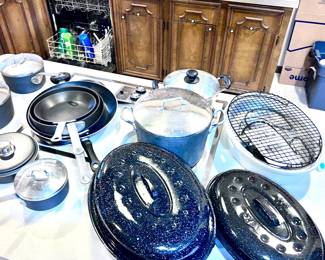 Large assortment of cooking pots and pans