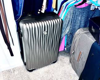 A large selection of hard case suitcases