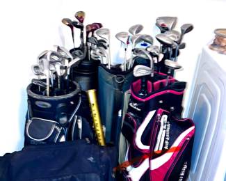 Numerous golf clubs and six golf bags and golf accessories